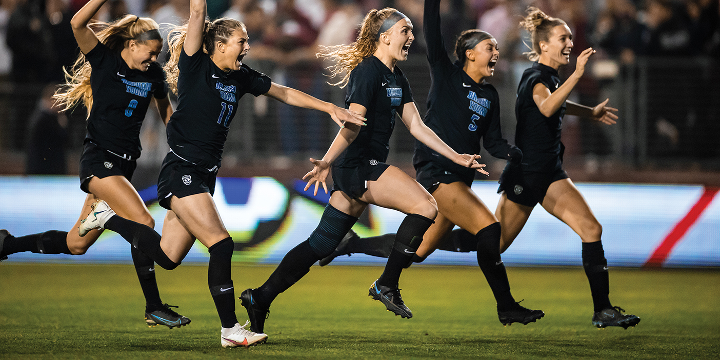 BYU women's soccer players run triumphantly across the soccer field after winning a shootout against rival Santa Clara to advance to the 2021 national championship game.