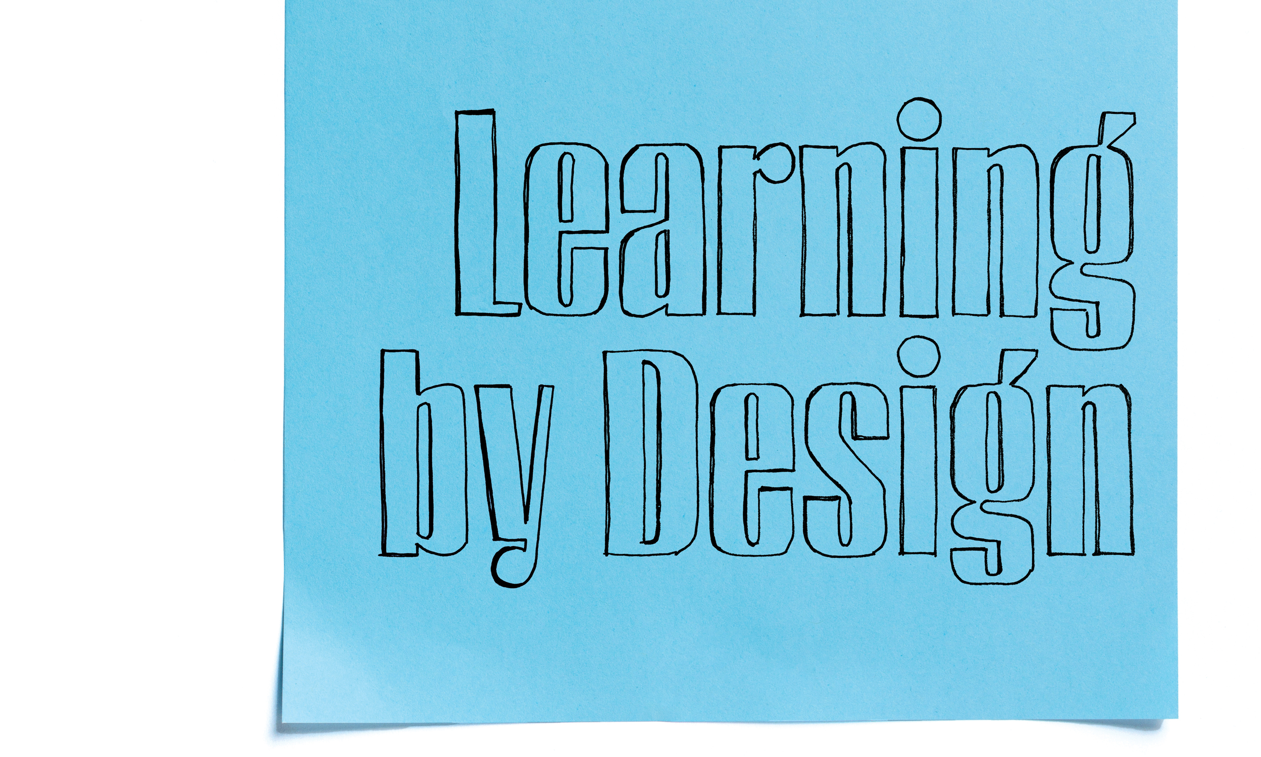 A blue sticky note that says "Learning by Design"