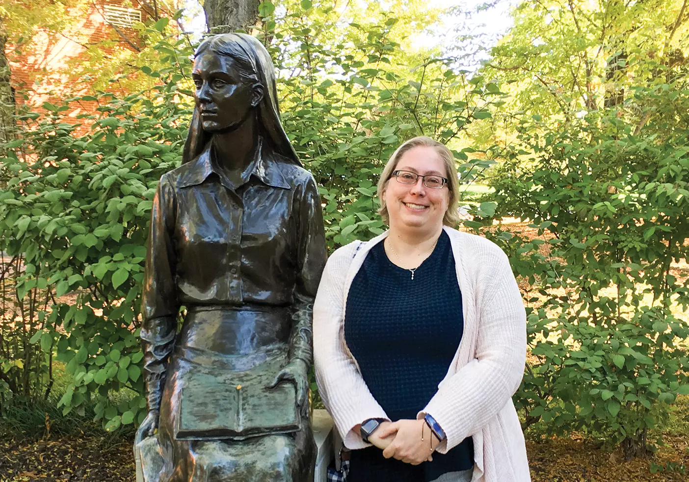 Ellen Jepson stands next to a statue in Nauvoo.