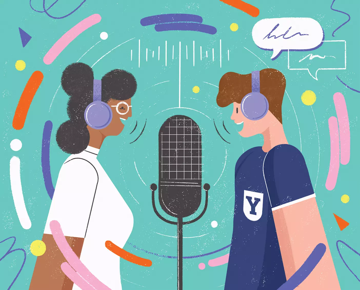 Two BYU podcasters wearing headphones stand on either side of a large microphone and speak.