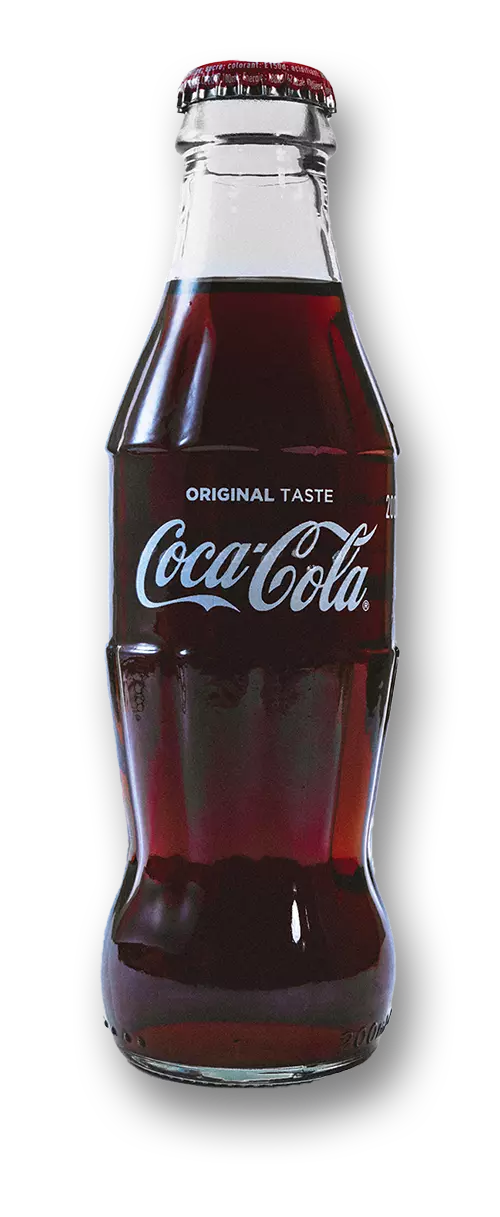 A small glass bottle of Coca Cola