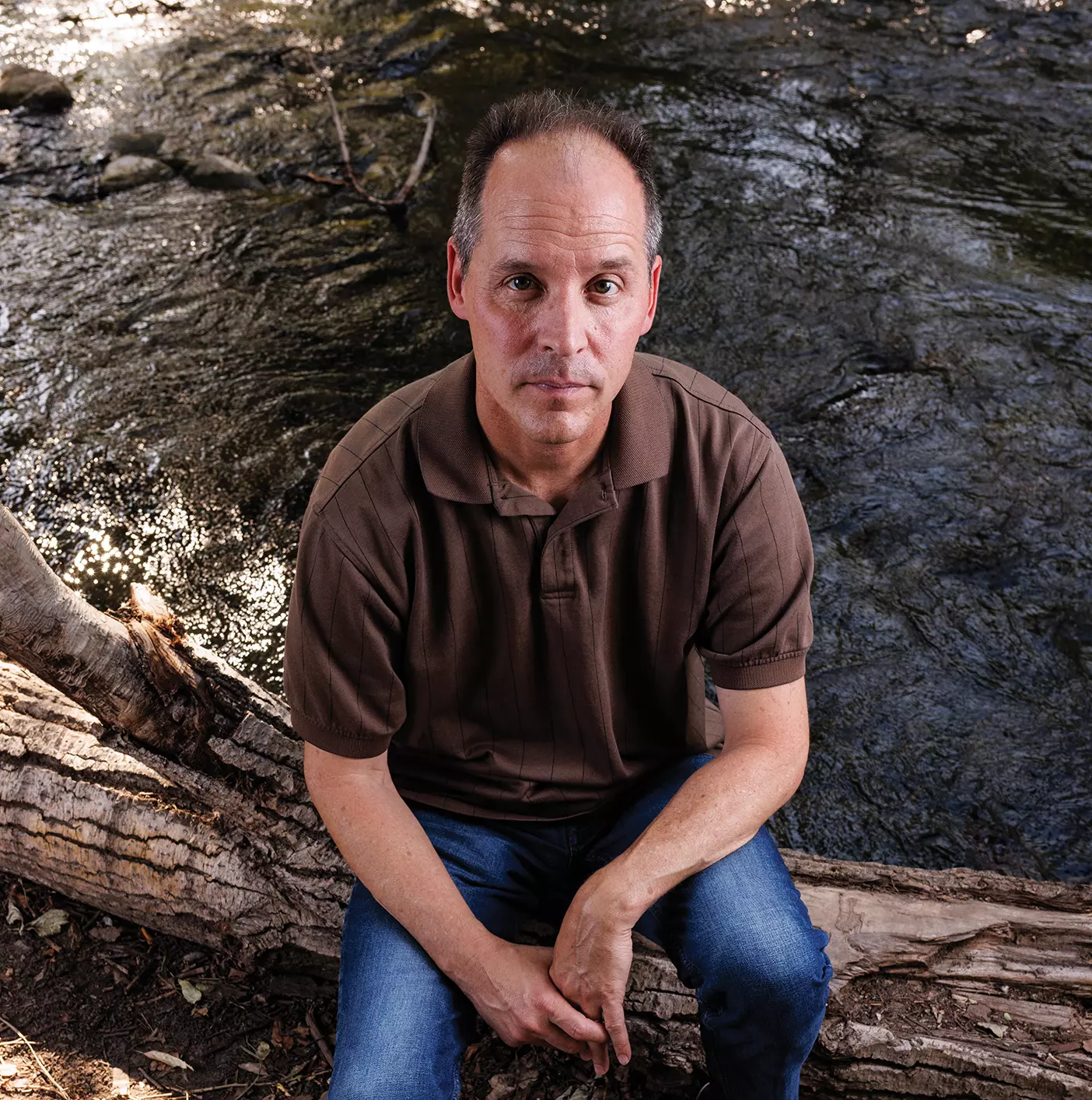 A dendrochronologist sits for a portrait.