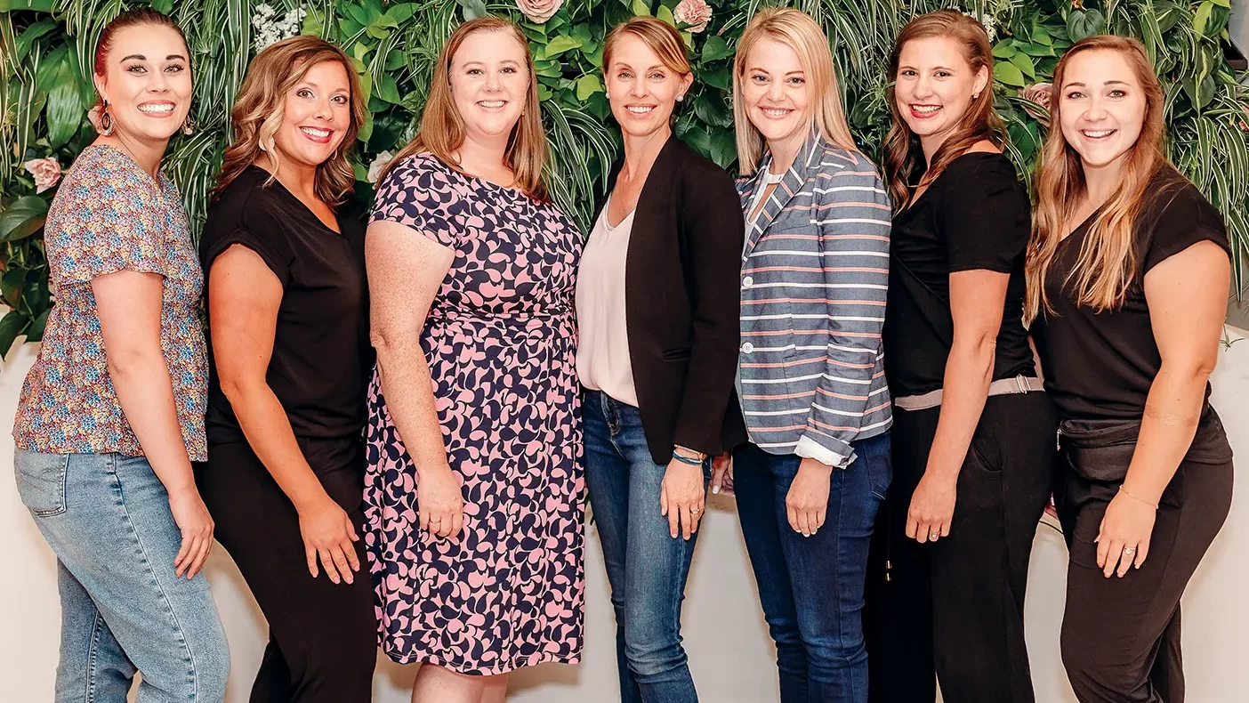 A group of female entrepreneurs pose together.
