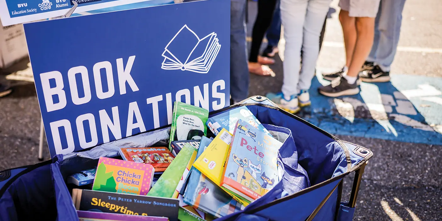 A collection of donated books at a BYU tailgate in Lynchburg, Virginia.