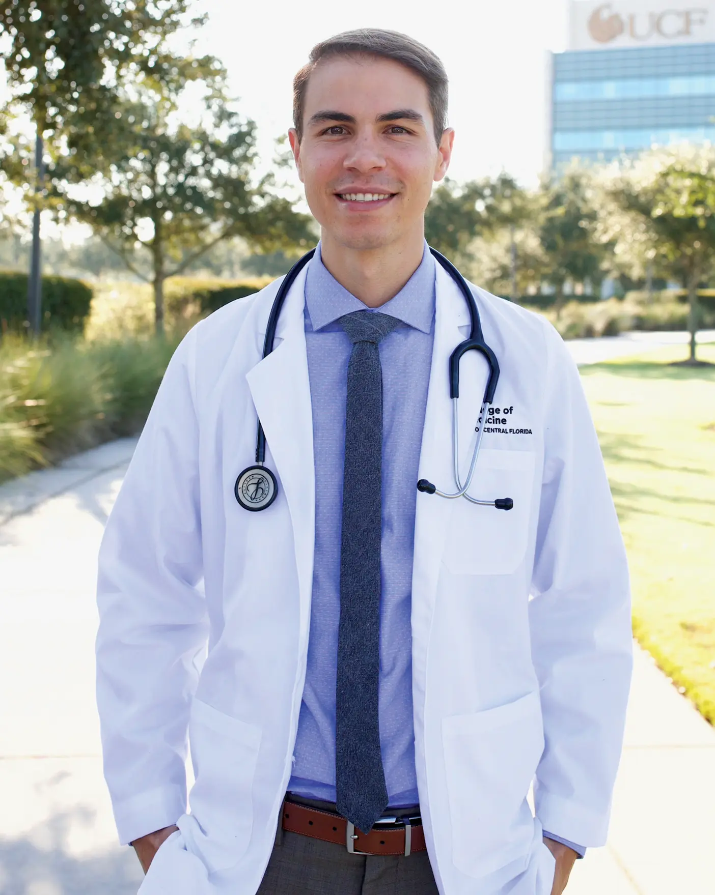 Thomas Knapp poses in a white doctor's coat and stethoscope. 