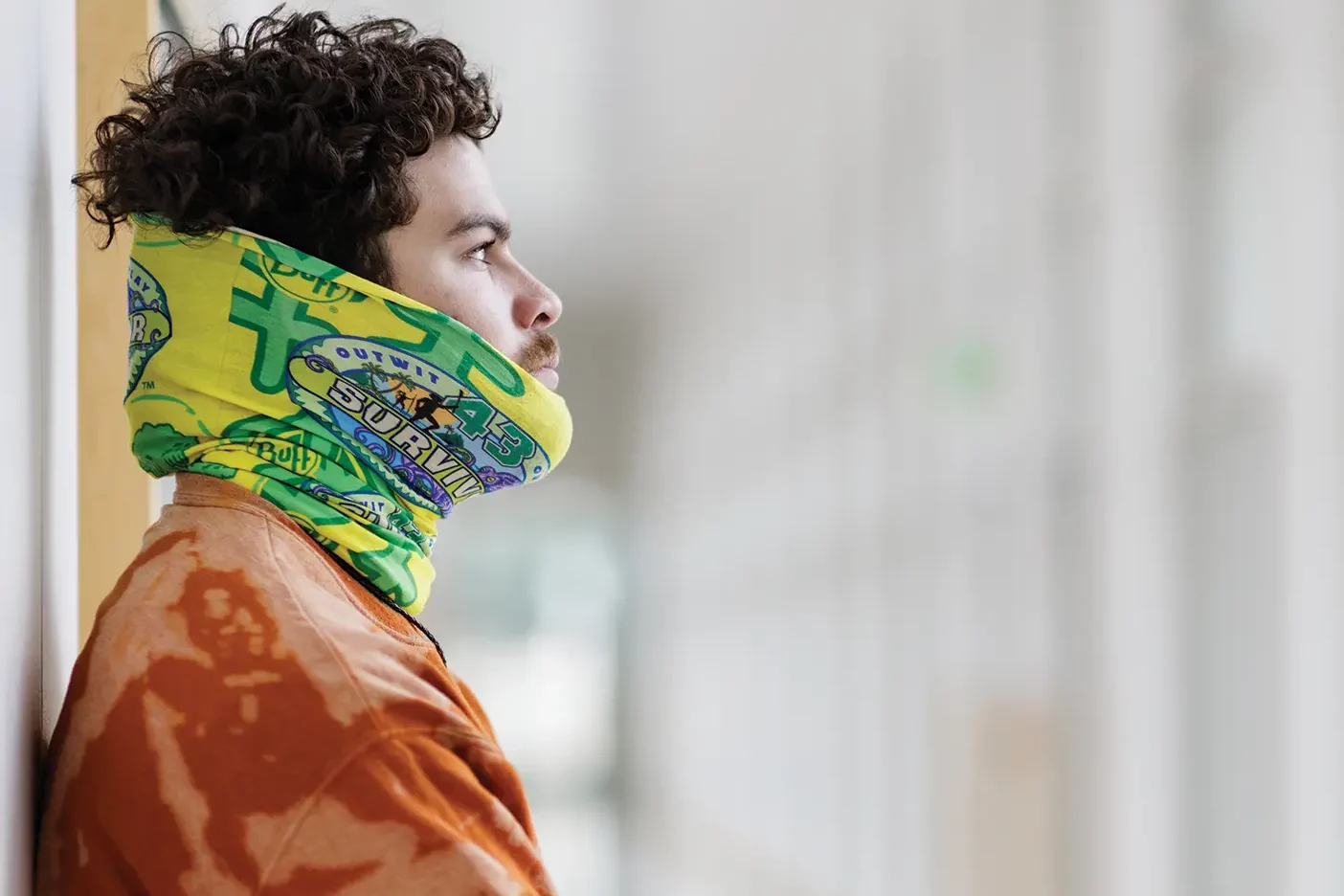 Sami Layadi ('25) poses in a hallway on campus while wearing his "buff", a special piece of clothing given to each Survivor cast member.