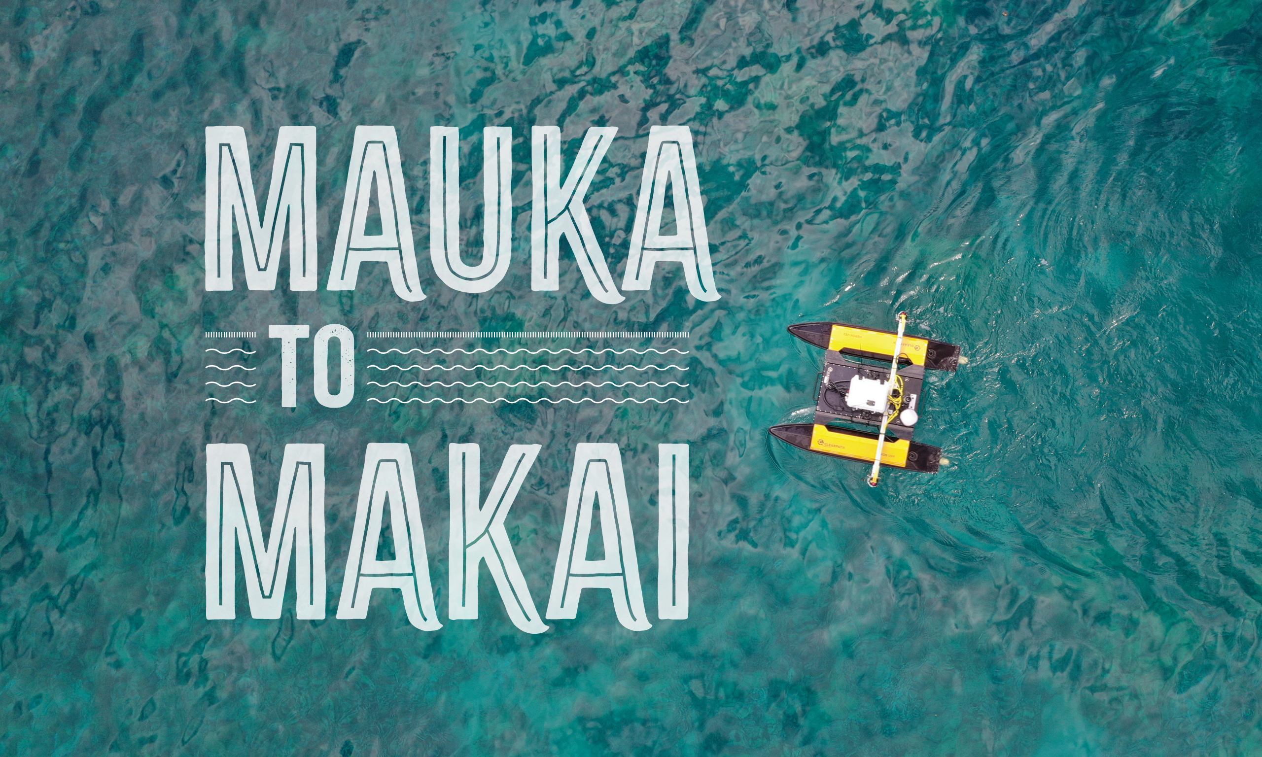 Article title: "Mauka to Makai" over water with a yellow autonomous aquatic drone.