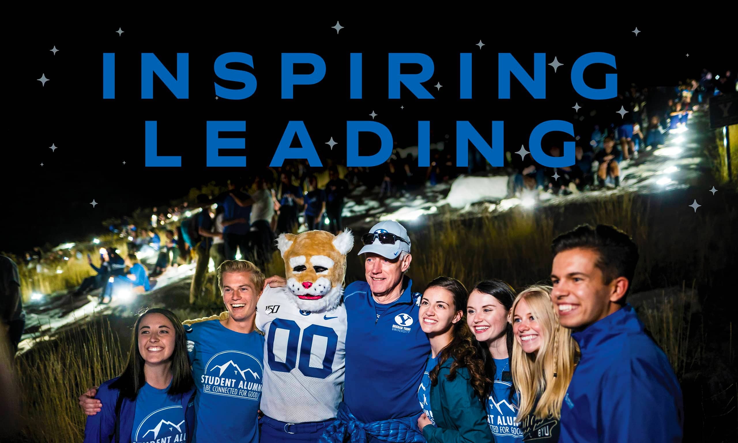 Photo of Kevin J Worthen with BYU students on the Y. A span of blue text reads "Inspiring Leading."