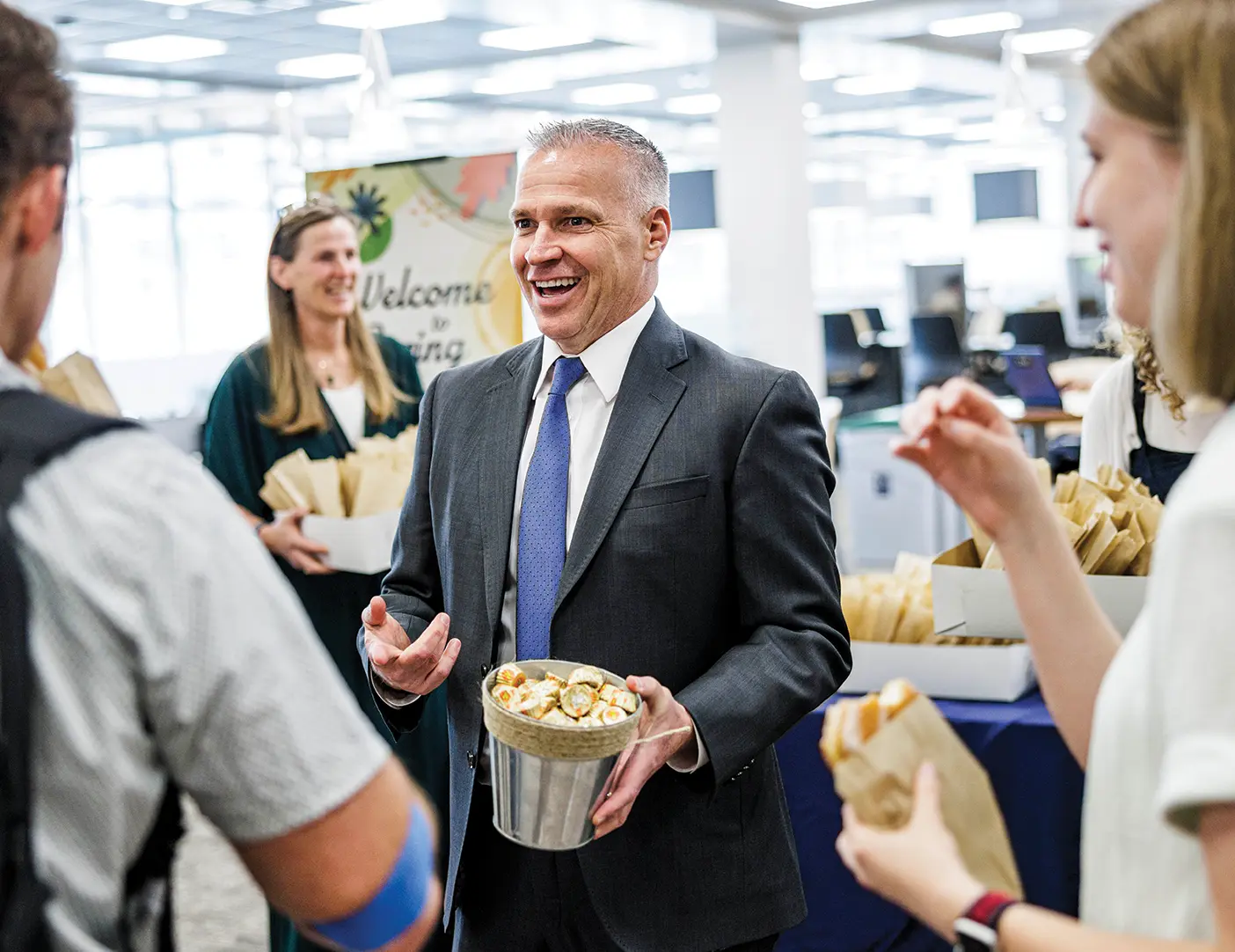 BYU president Shane Reese greets students at the BYU library to celebrate the start of spring term.