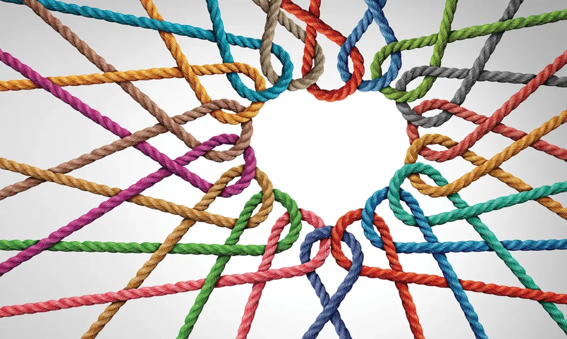 Colorful strings woven together to make a heart shape in the middle.