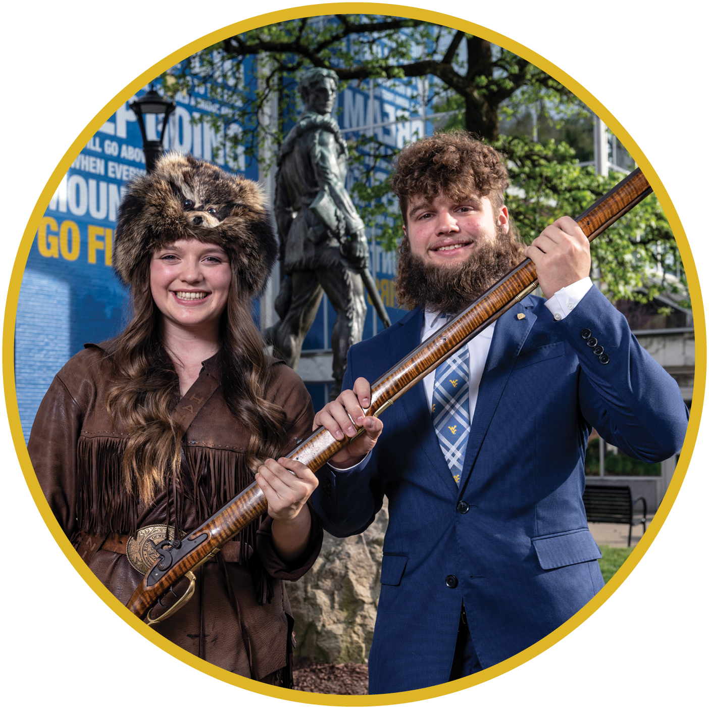 A female and male student dressed as mountaineers at West Virginia University