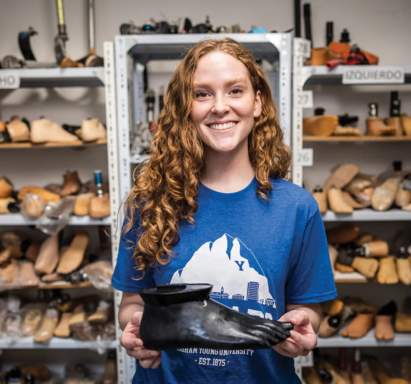 Student Lexi Healey displays a BYU-engineered prosthetic foot shell.