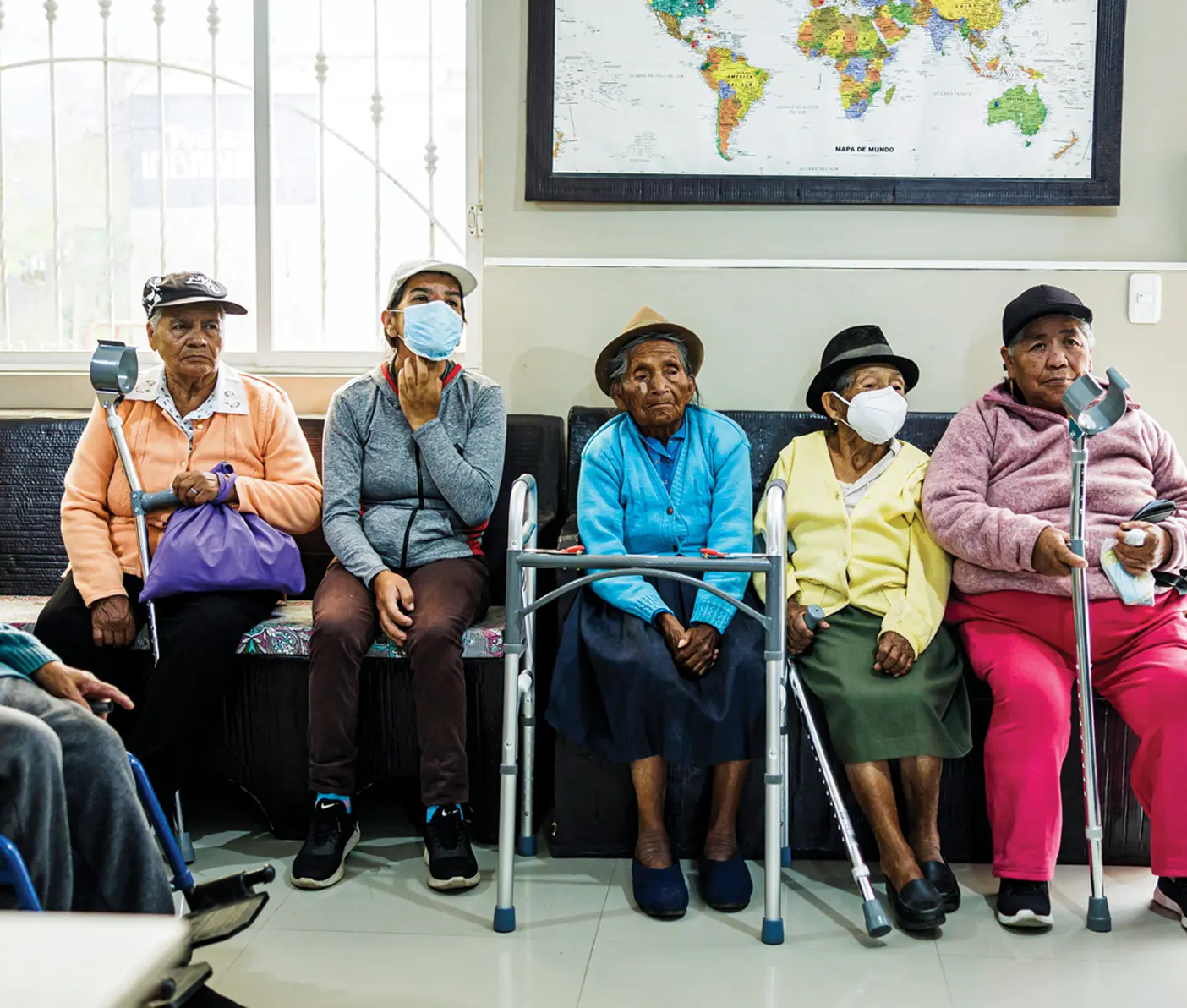 Elderly patients await their appointments for medical equipment checks and therapy at a clinic in Ibarra, Ecuador.