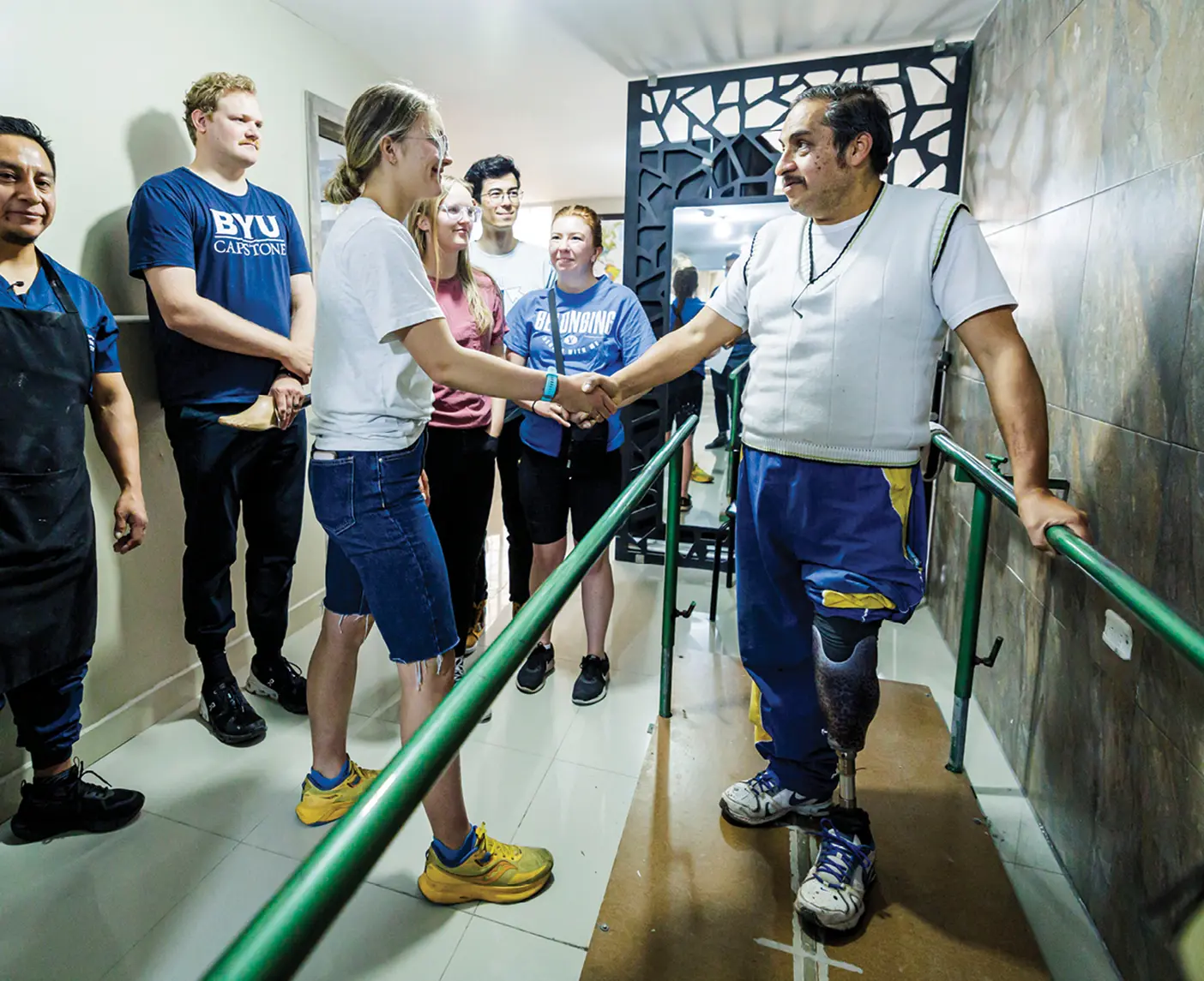 Amputee Jairo Rosero (right) tests a new prosthetic foot at a clinic in Ibarra, Ecuador.