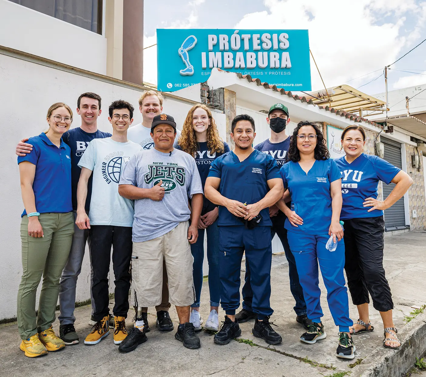 BYU students pose with Ecuadorians outside a prosthetics clinic in Ibarra, Ecuador.