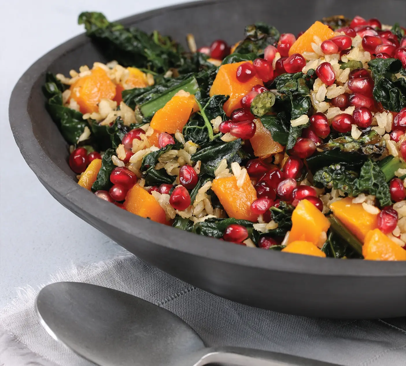 A bowl of kale butternut squash salad.