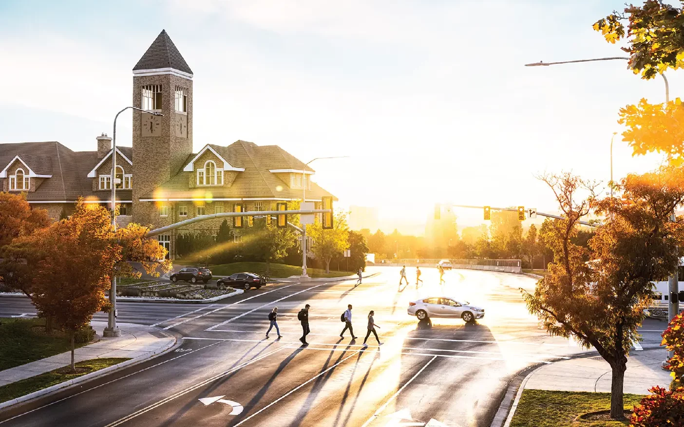 Image of a BYU campus street at sunset.