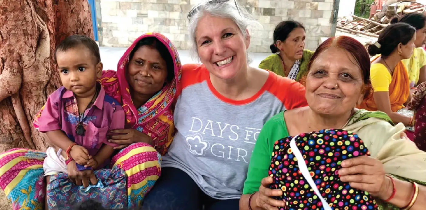 Celeste Mergens with women and a baby in India.