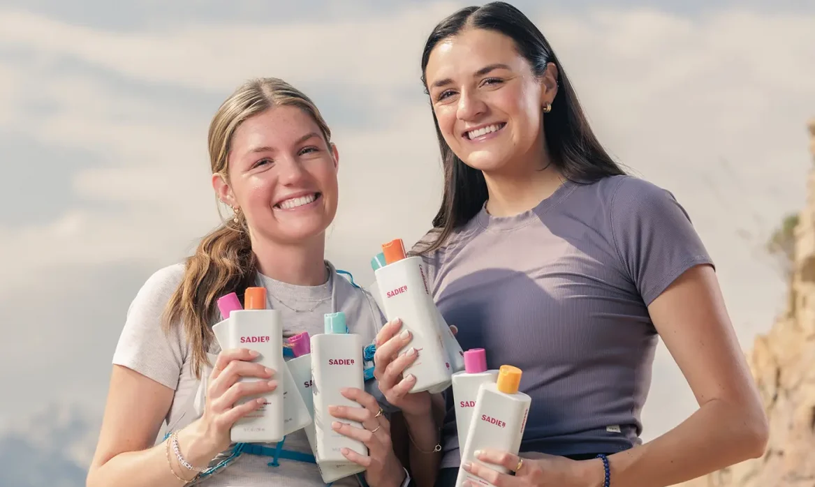 Abby and Sadie Bowler stand with their product, SadieB.