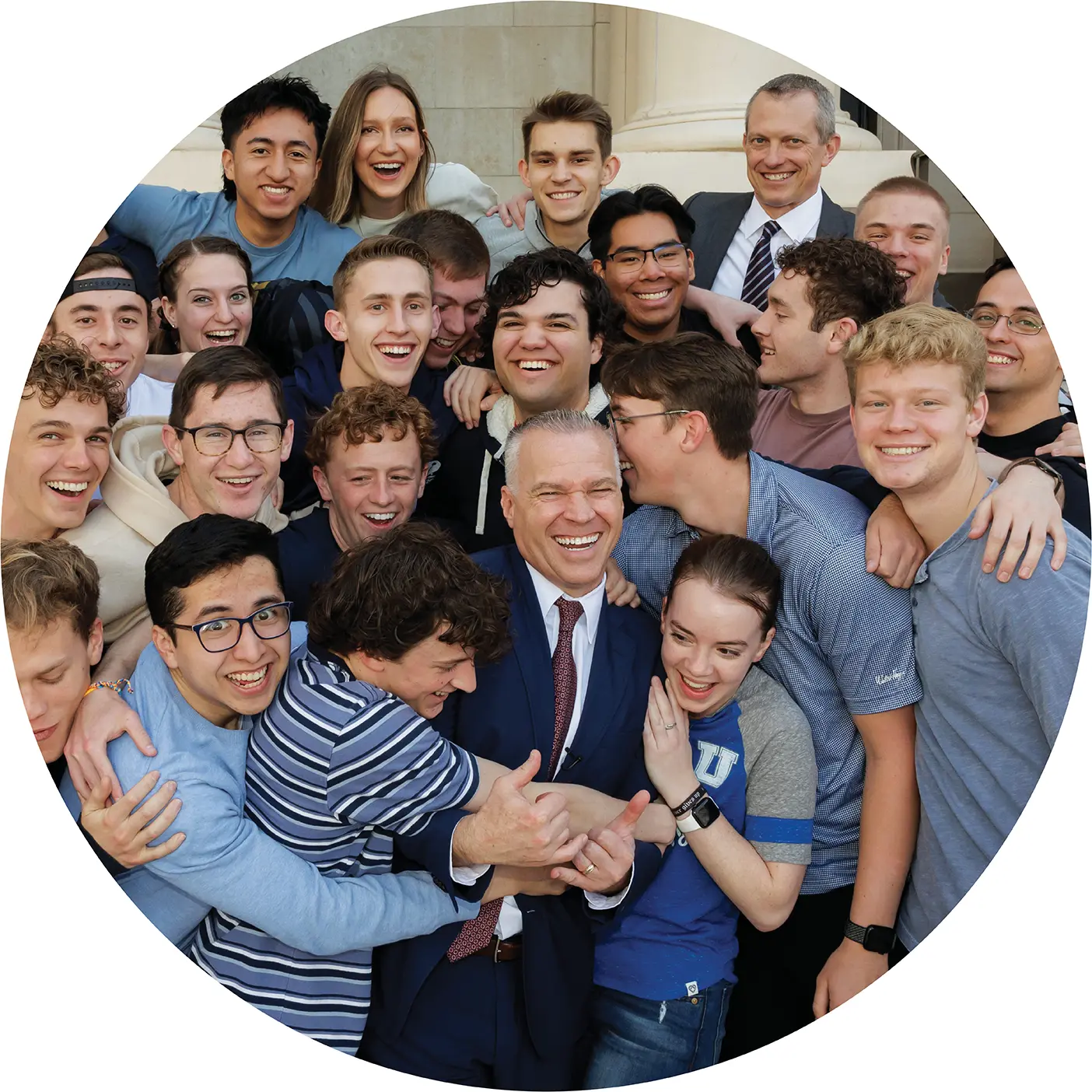 BYU president C. Shane Reese in a playful pose with students in his UNIV 101 course.