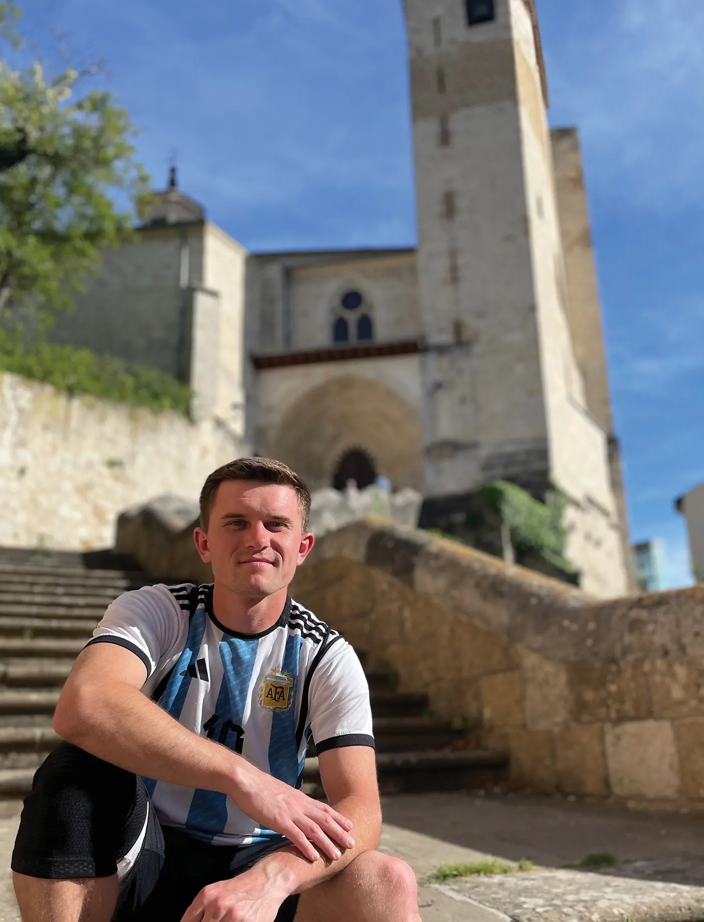 BYU student Samuel Pratt in front of a church in Spain.