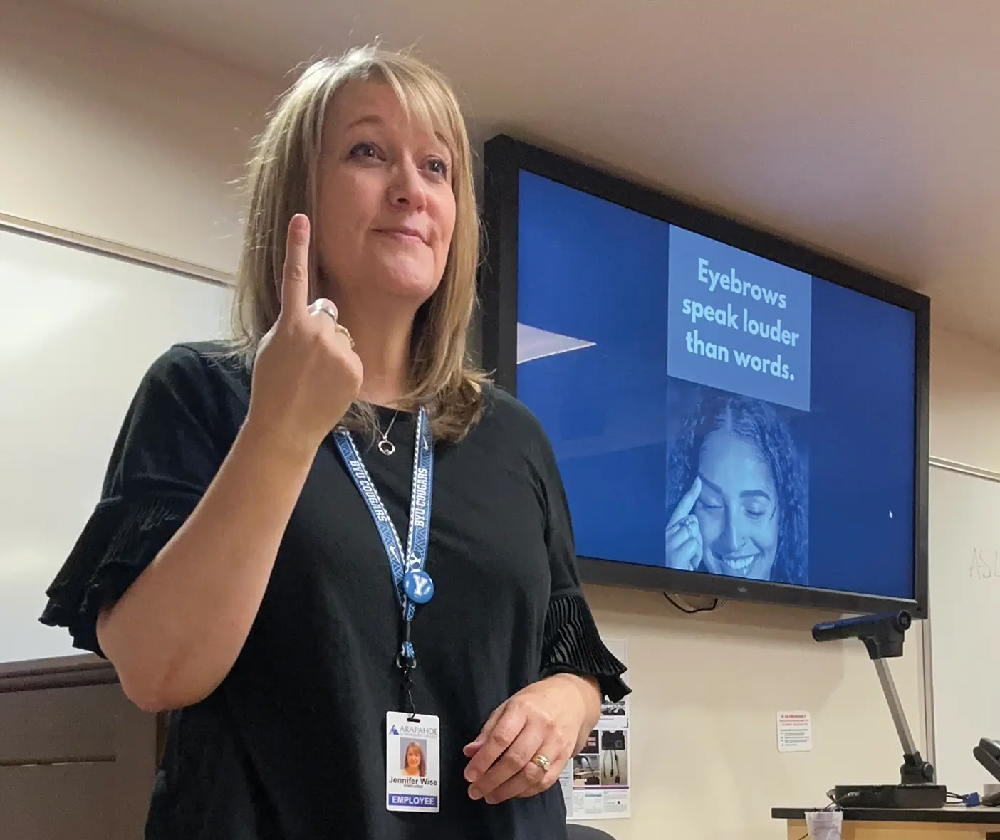 Jennifer Wise teaching sign language.