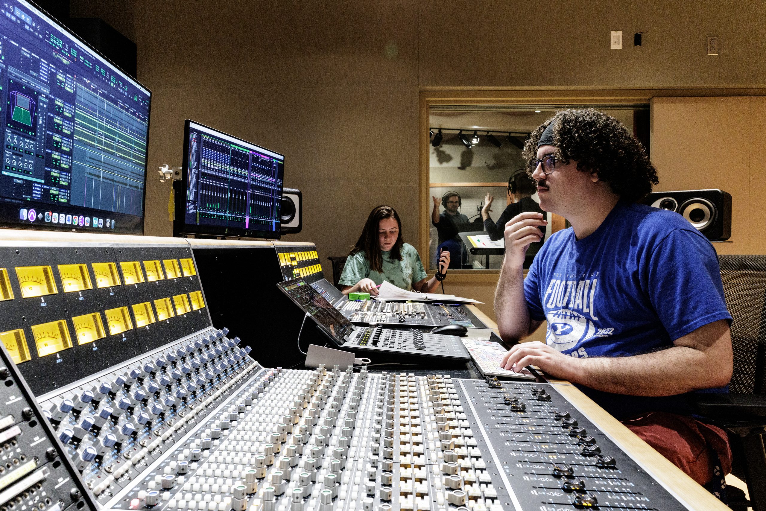 Students mix audio for BYUradio's Kaboom: An Audio Adventure Podcast.