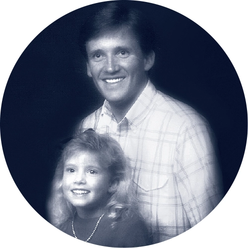 An older photo of Kevin Duncan smiling with his young daughter Aubrey.