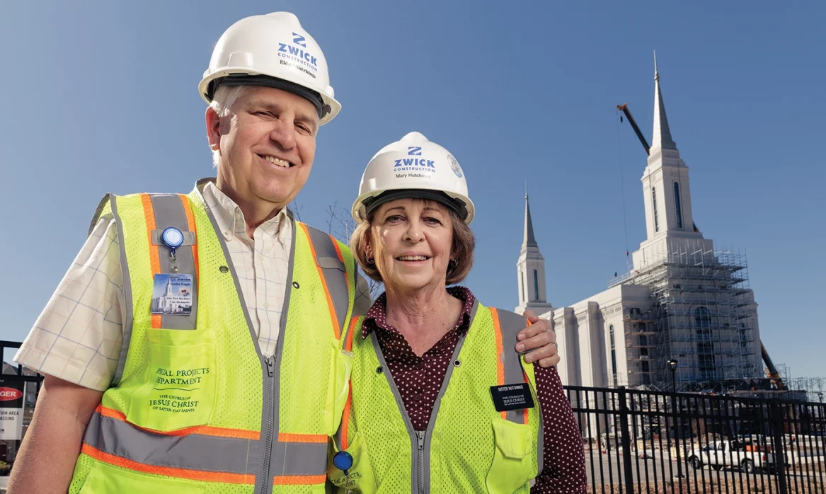 Mark and Mary pose together in front of the partially-constructed Lindon Utah Temple.