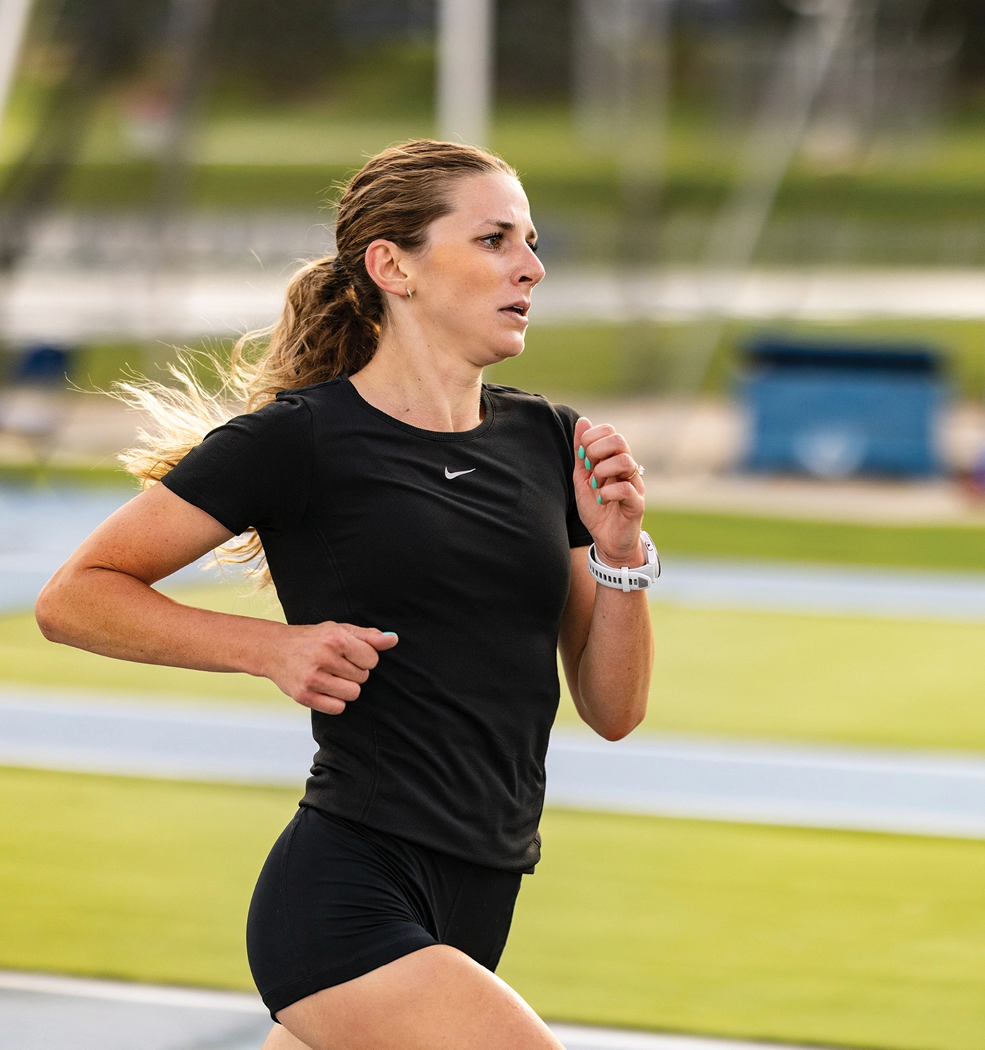 Kylie Mantz sprints down a track in exercise clothing.