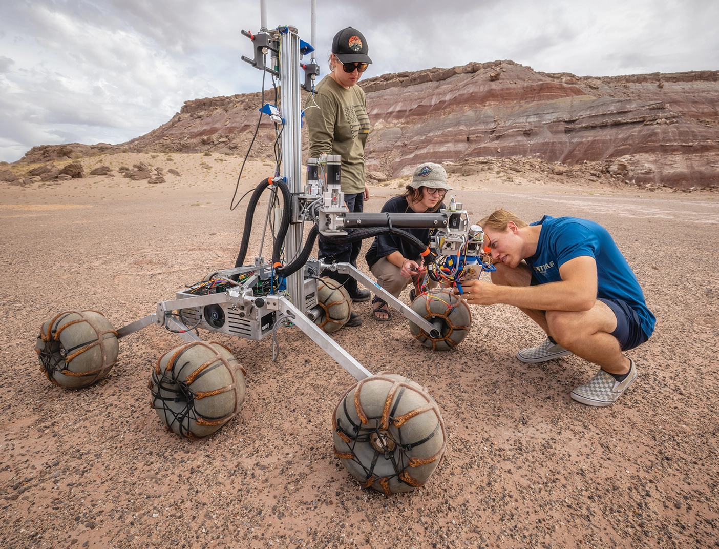 Students work on their rover in the desert landscape of southern Utah. 
