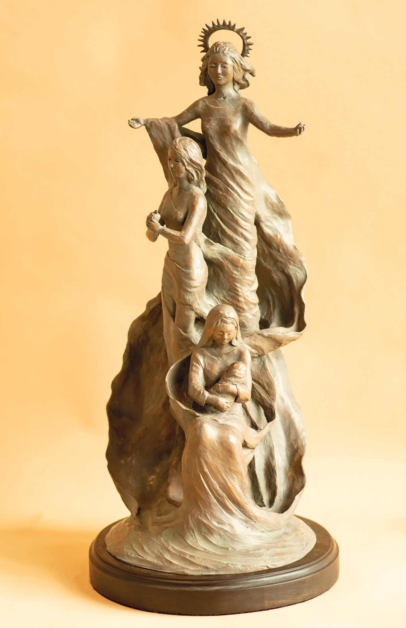A sculpture depicting 3 mothers/religious figures.