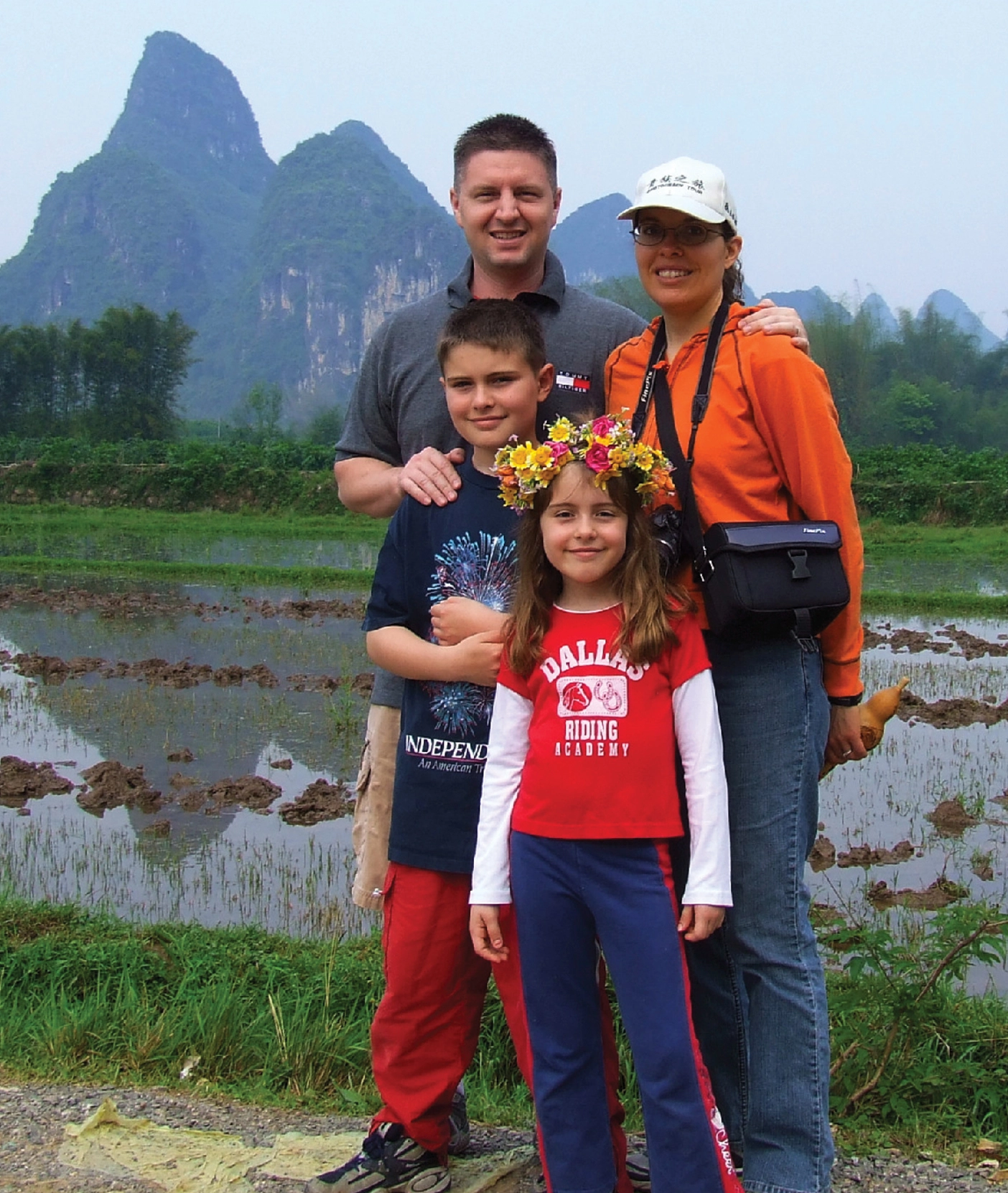 Steven Smith stands with his wife and two kids.