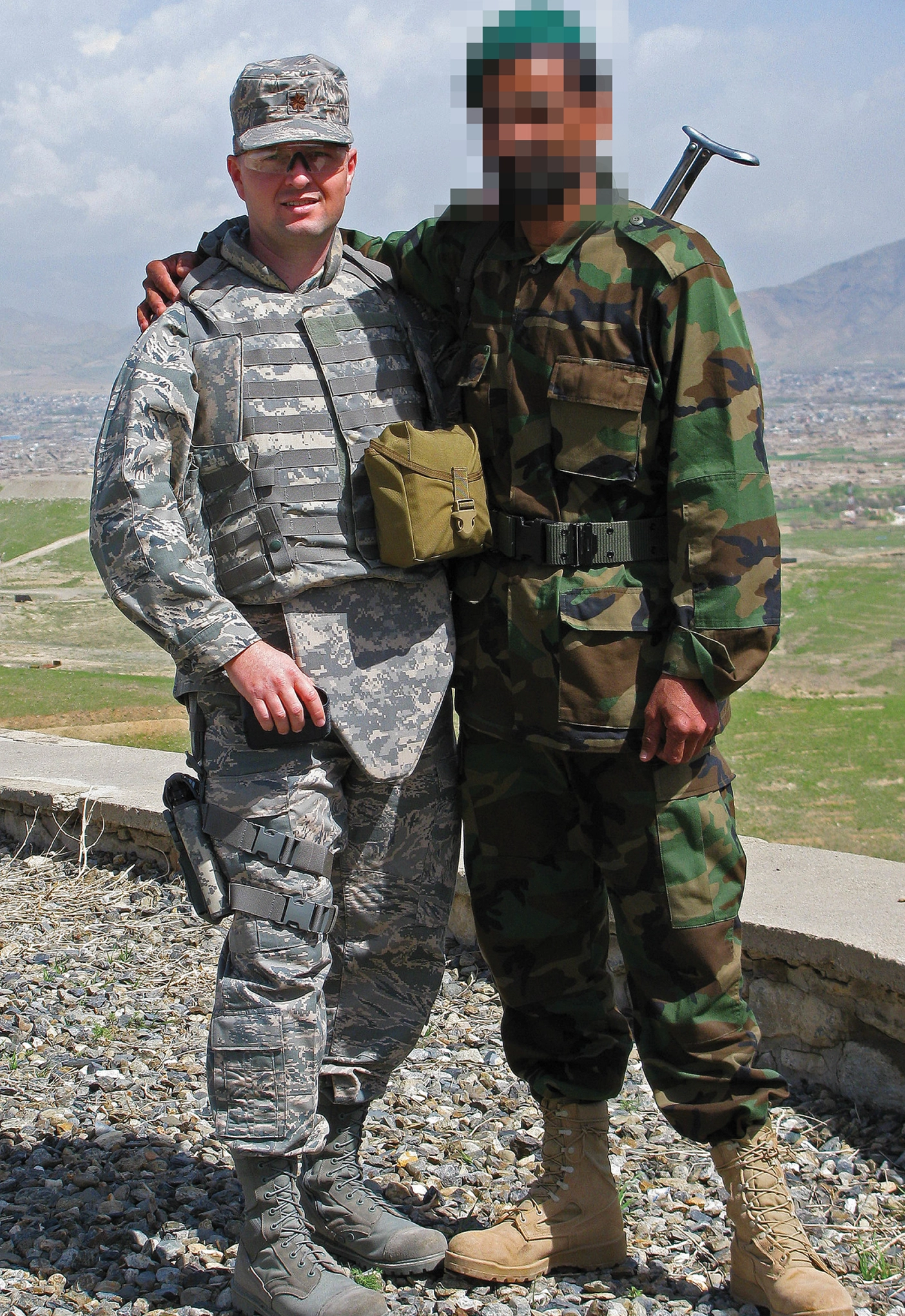 Steven Smith poses with an Afghan National Army soldier (face blurred to protect his identity).