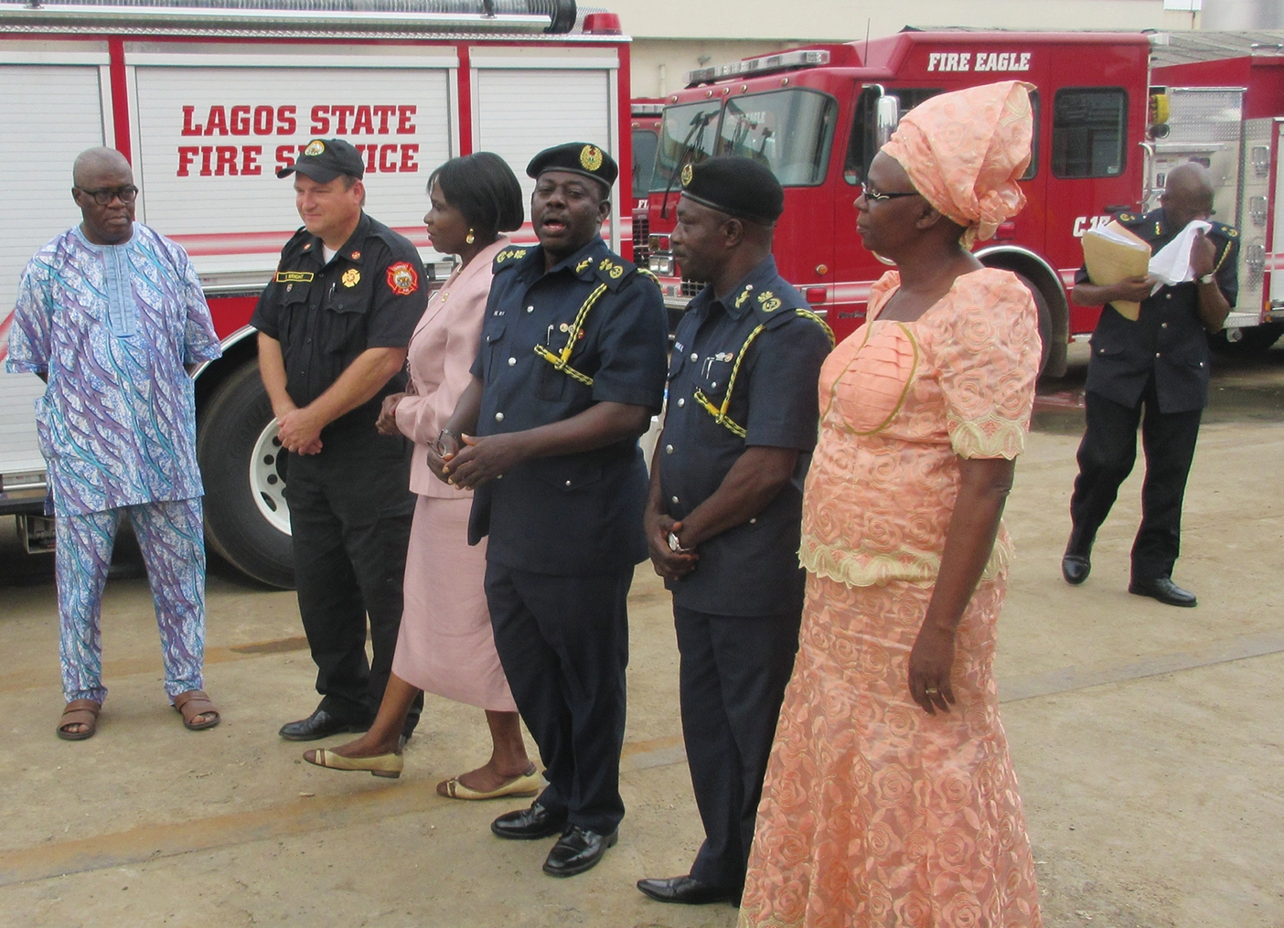 Program chief Edward Wright (second from left) presents US-made firefighting equipment to Lagos government officers and state fire officials.