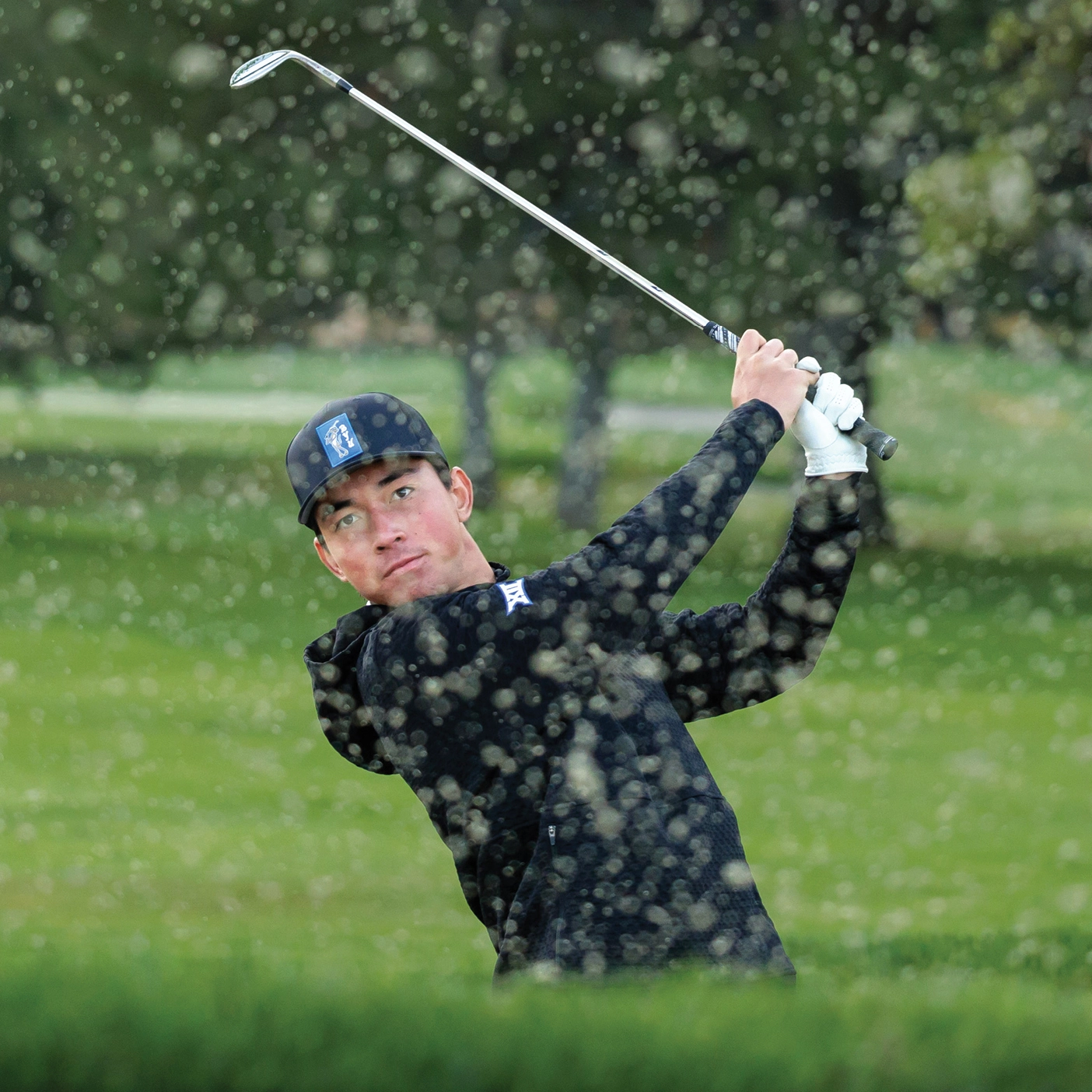 BYU golfer Kihei Akina golfs on a green course.