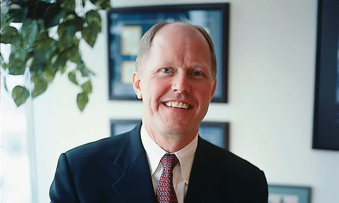 James Stice poses in an office.
