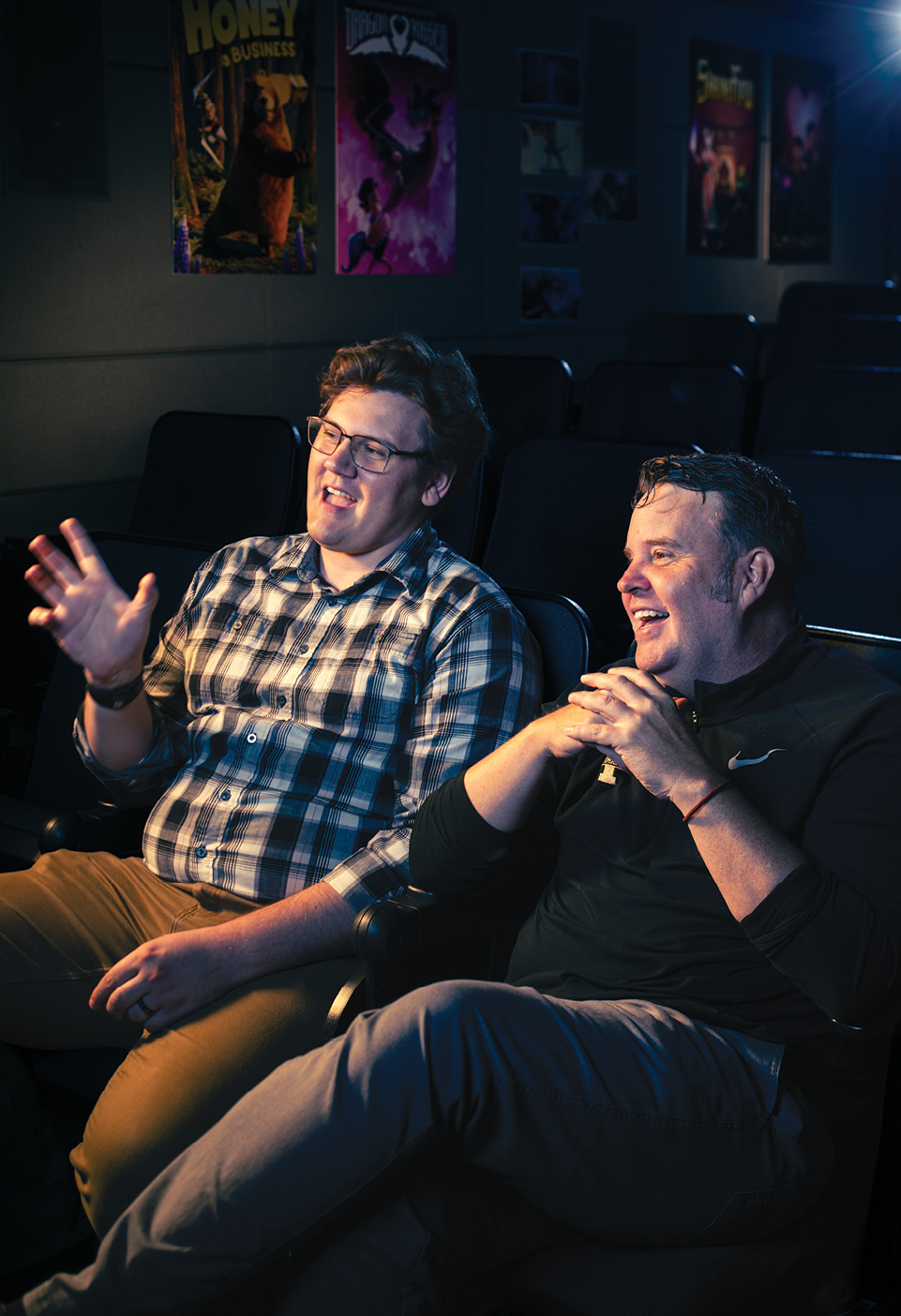 Father and son animators Craig and Connor Van Dyke sit together insight BYU's animation lab cinema.