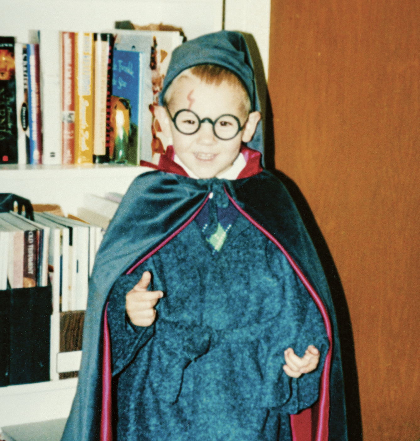 A little boy dressed up as Harry Potter.