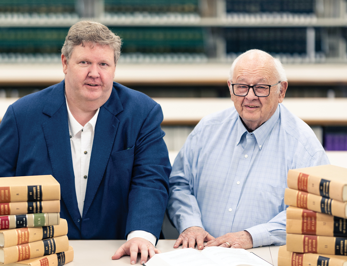 Jeremy and Clayne Pope stand together in a library on BYU's campus.