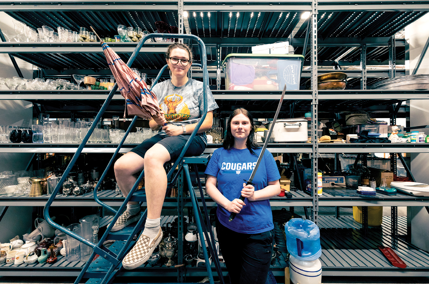 TMA students Brittalena Davis (’27), left, and Raelynn Pitts (’27) are poised to prop up any production in the BYU Arts Building.
