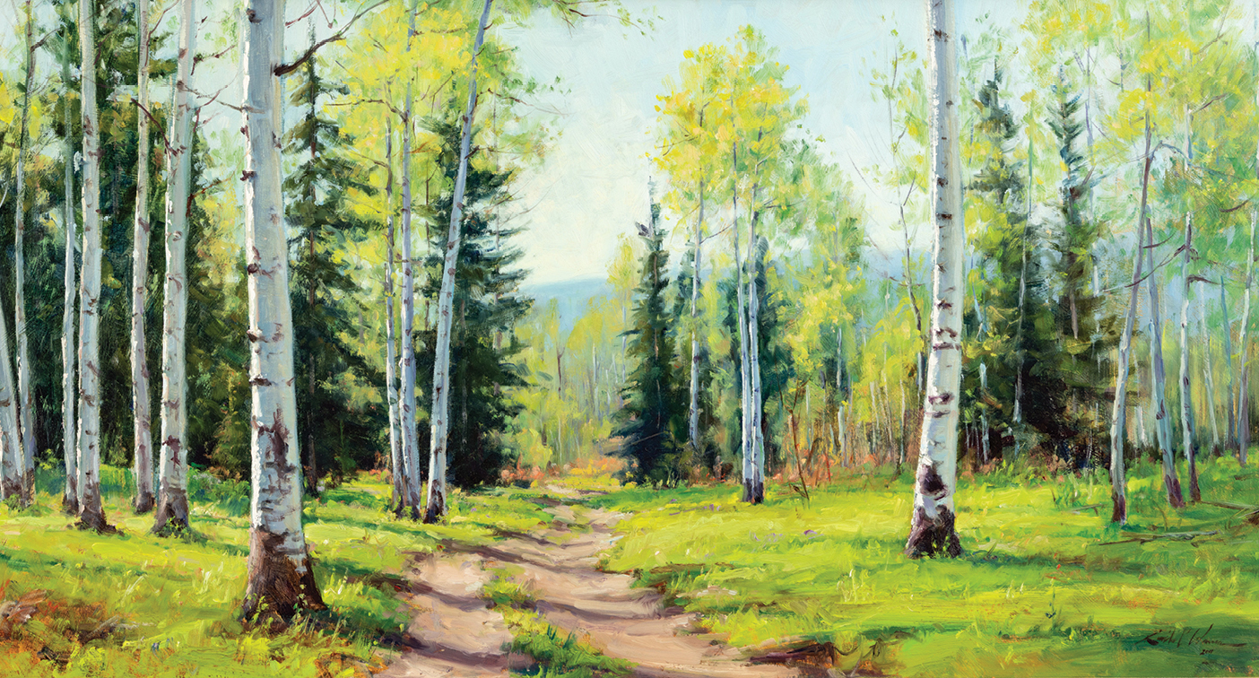 A grove of aspen trees alongside a path.
